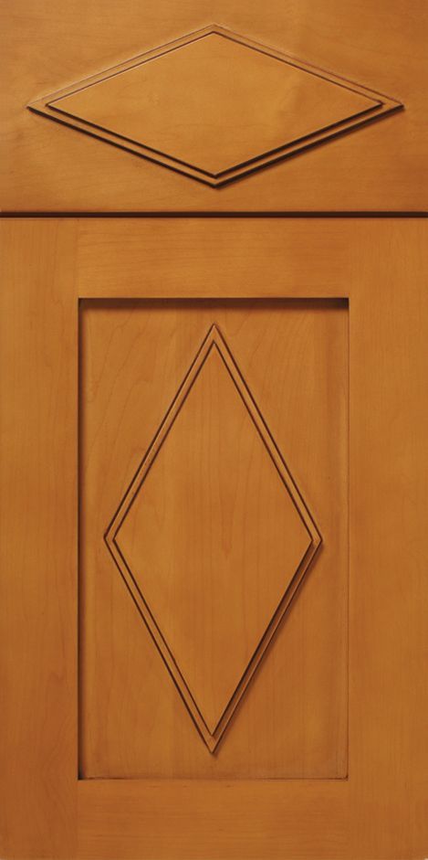 Wooden cabinet doors with diamond-shaped designs.