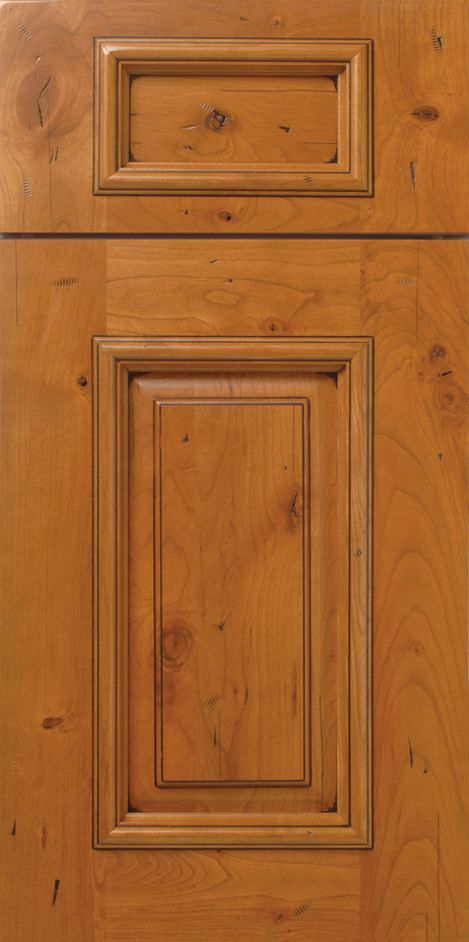 Wooden cabinet door with raised panel and wood grain details.