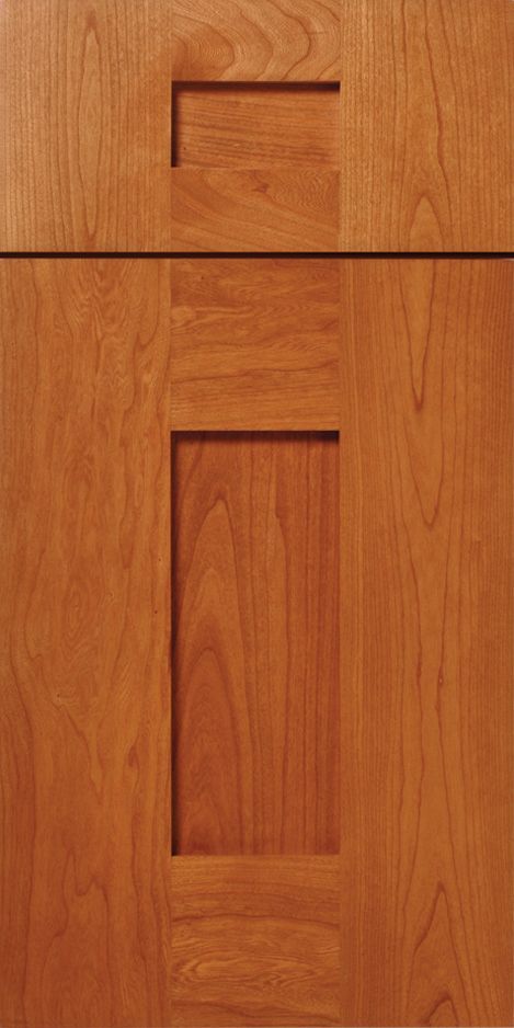 Wooden cabinet door with inset rectangular panels and a cutout handle.