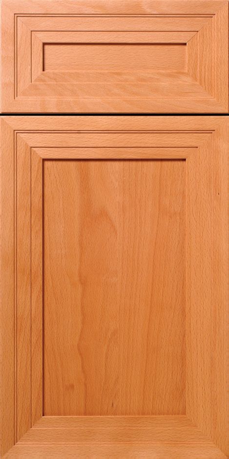 Close-up of a light brown wooden cabinet door with layered rectangular panel design.