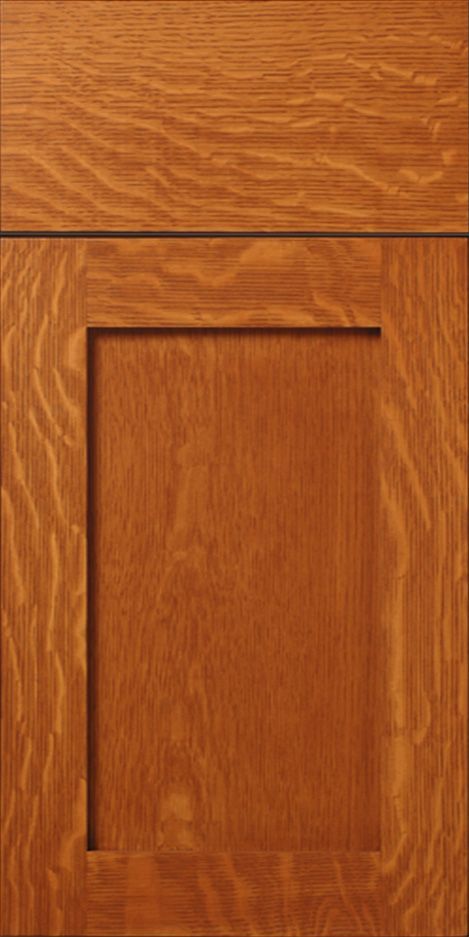Wooden cabinet door with a recessed panel, stained a warm brown.