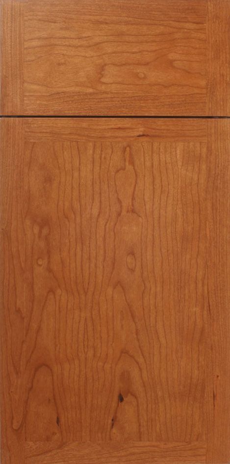 Wooden cabinet door with a warm, reddish-brown stain.