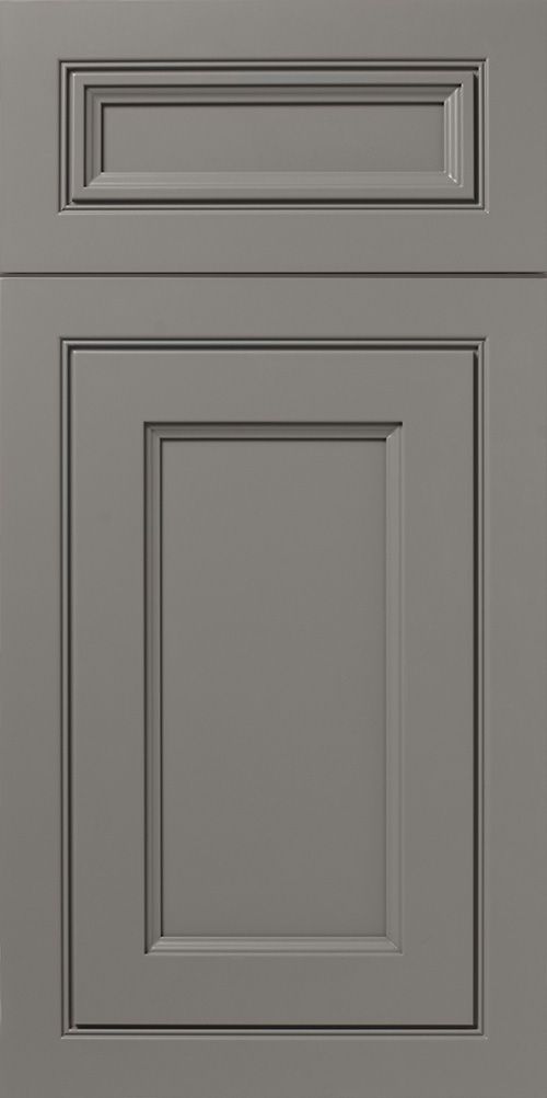 Gray cabinet door with raised panel and rectangular detail at the top.