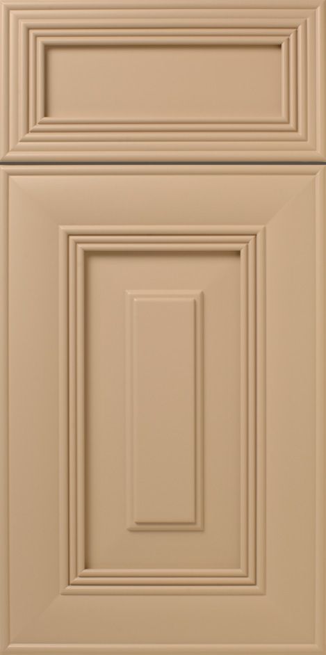 Tan cabinet door with raised panel detailing.