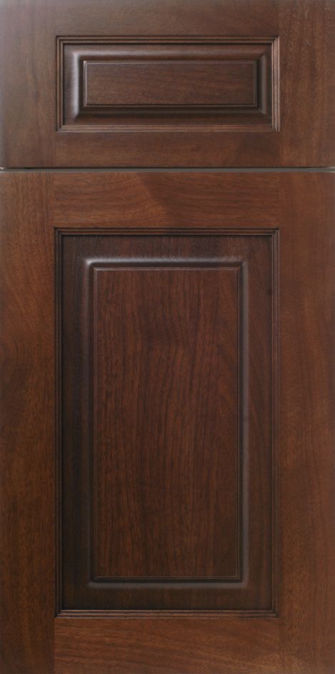 Dark brown kitchen cabinet door with raised panel and top rectangle.