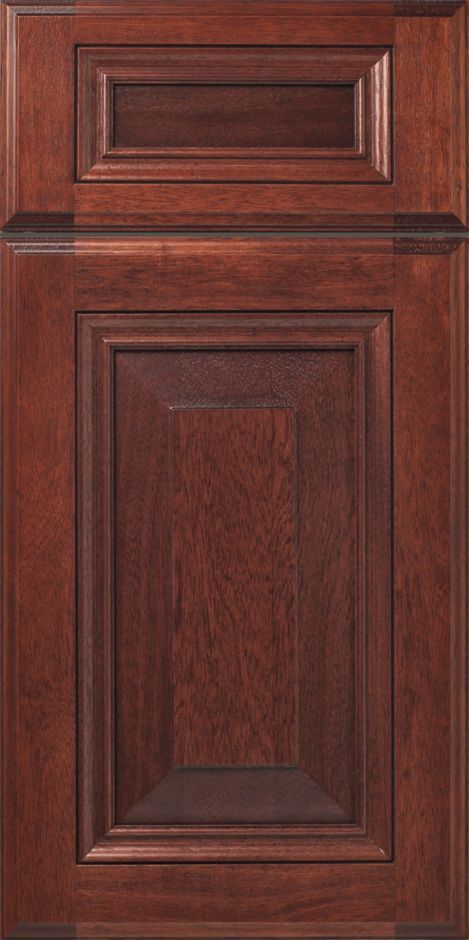 Dark brown wooden cabinet door with recessed panels and molding.