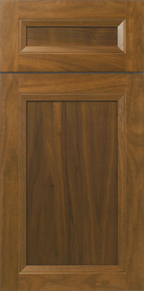 Brown wooden cabinet door with a recessed panel and raised top panel.