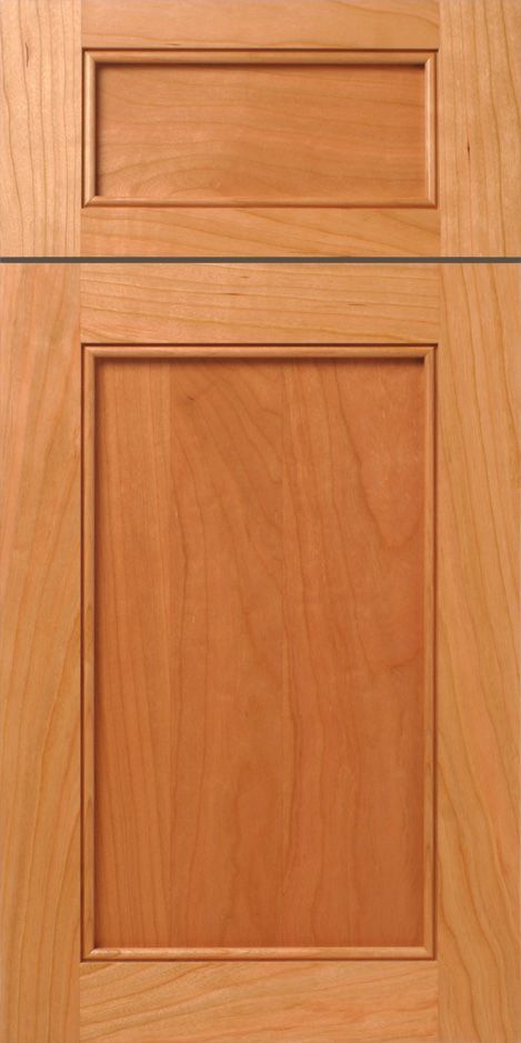Wooden cabinet door with a raised panel design and reddish-brown stain.