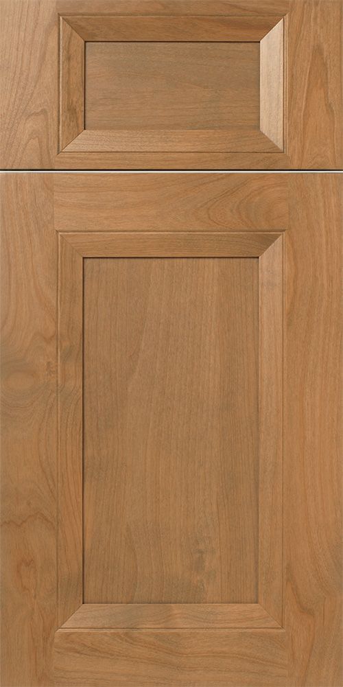 Wooden kitchen cabinet door with a raised panel and a light brown stain.