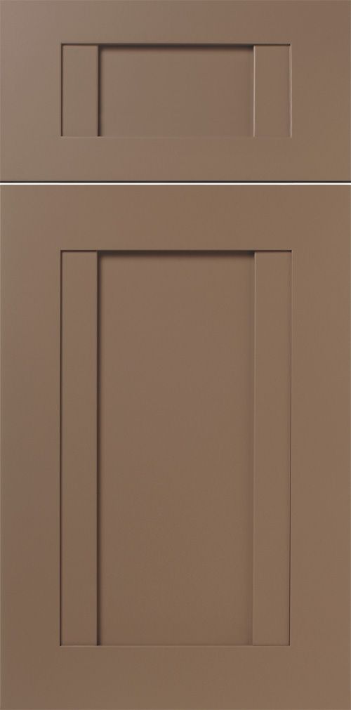 A close-up of two cabinet doors with a brownish color. The top door is smaller.