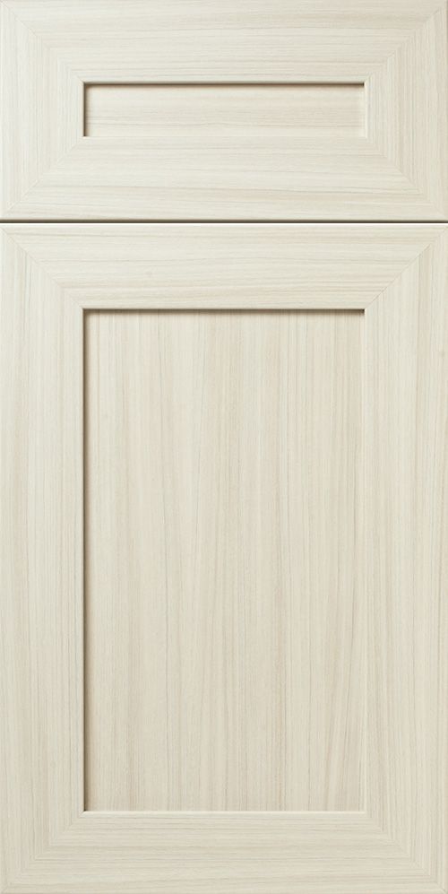 Light wood grain cabinet door with a recessed panel.