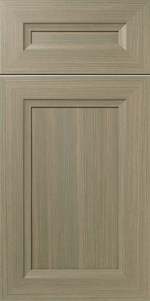 Light gray, wooden kitchen cabinet door with recessed paneling.