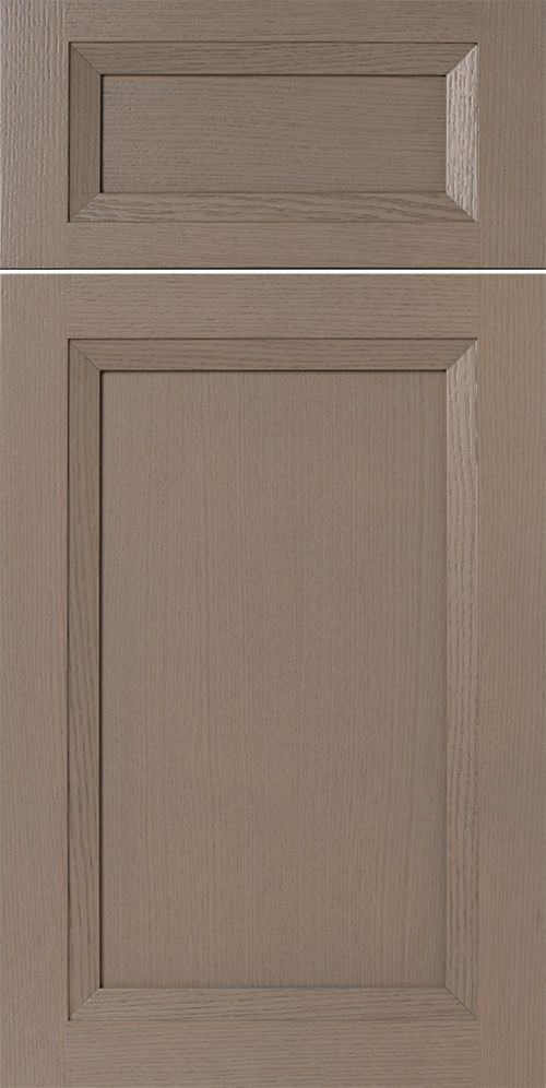 Two-toned wooden cabinet doors. One small, rectangular, the other larger. Both have a gray finish.