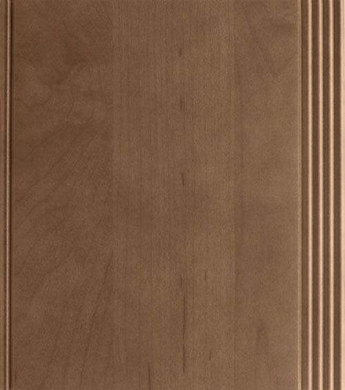 Cabinet door in light brown wood with grooved edge.