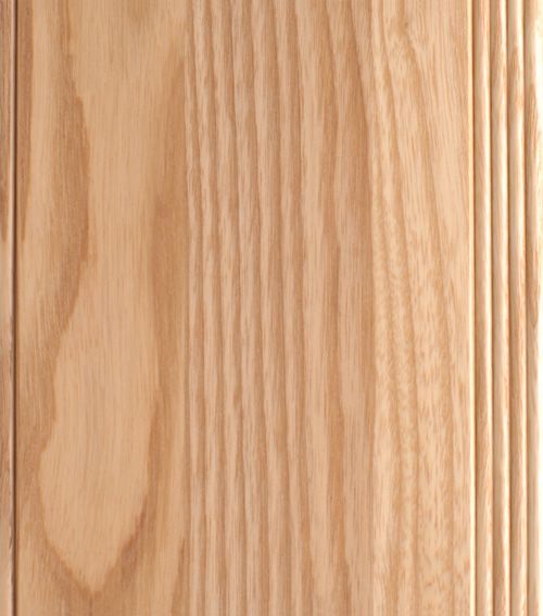 Light-colored wooden panel with vertical grain and carved lines on the right edge.