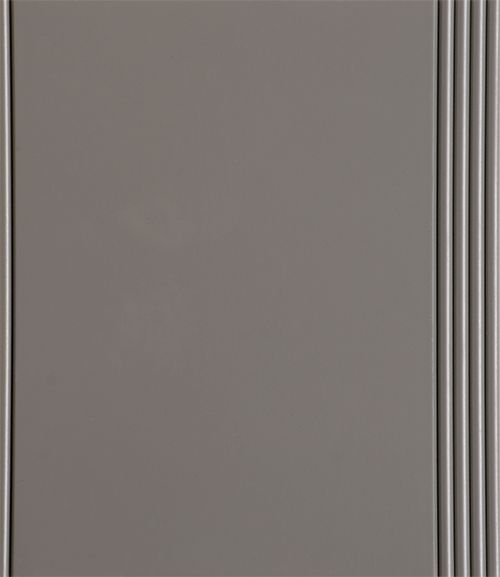 Gray cabinet door with vertical grooved trim on the right side.