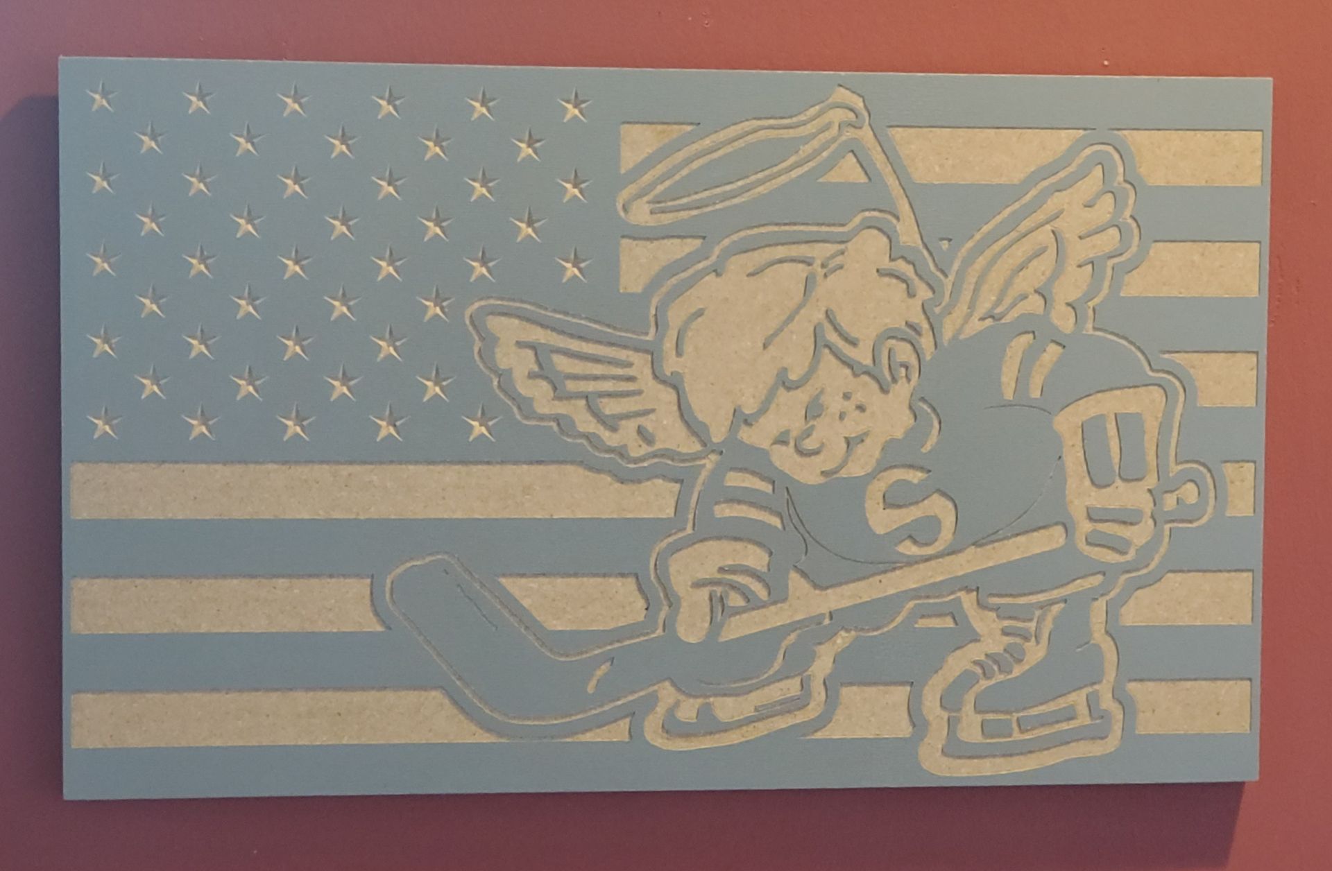 American flag design featuring an angel hockey player, with blue and white colors.