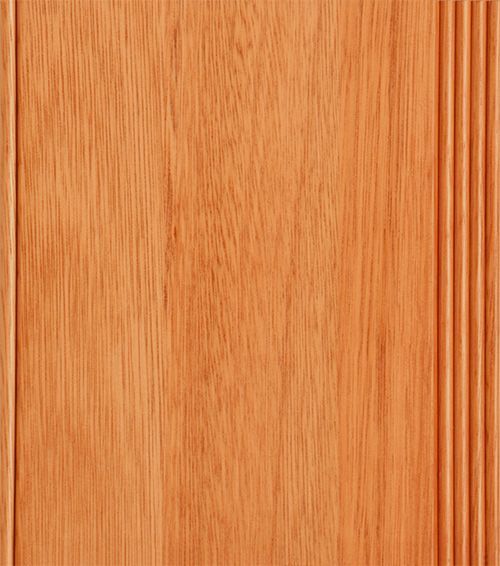 Close-up of a vertical wood panel with light brown color and a grooved edge.