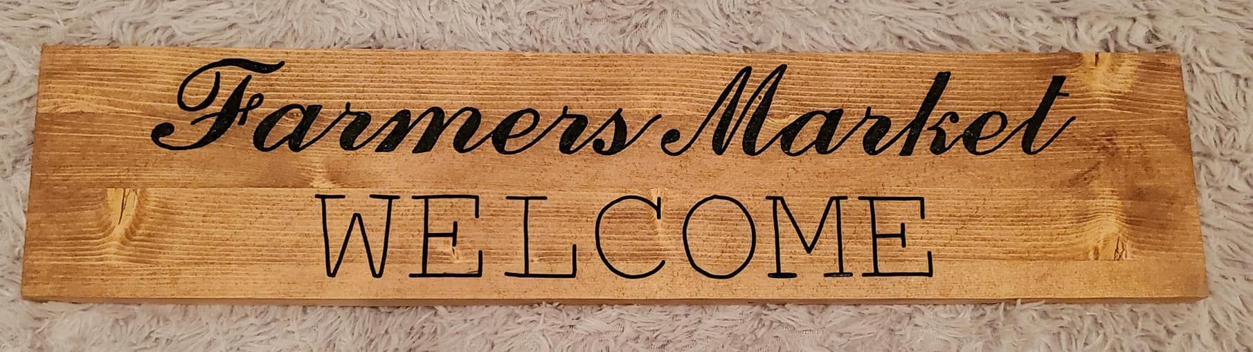 Wooden sign that reads