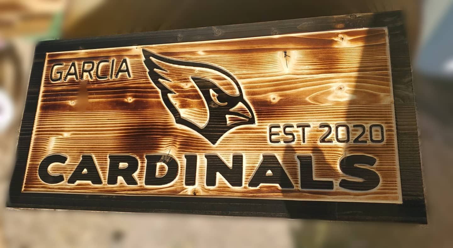 Wood sign with burned-in logo of Arizona Cardinals,