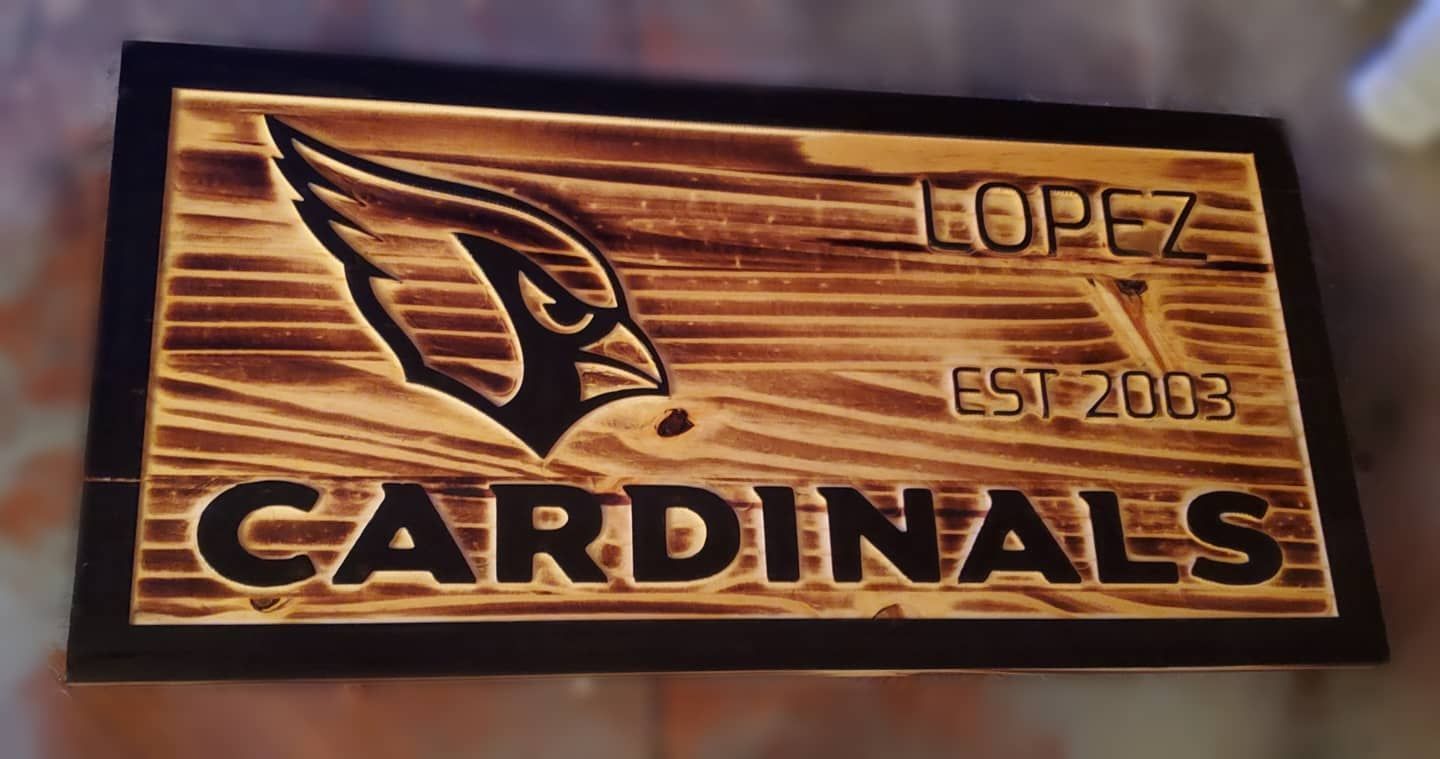 Wooden sign with Arizona Cardinals logo,
