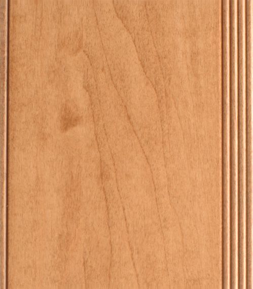 Light brown wooden cabinet door with vertical grain and grooved trim.