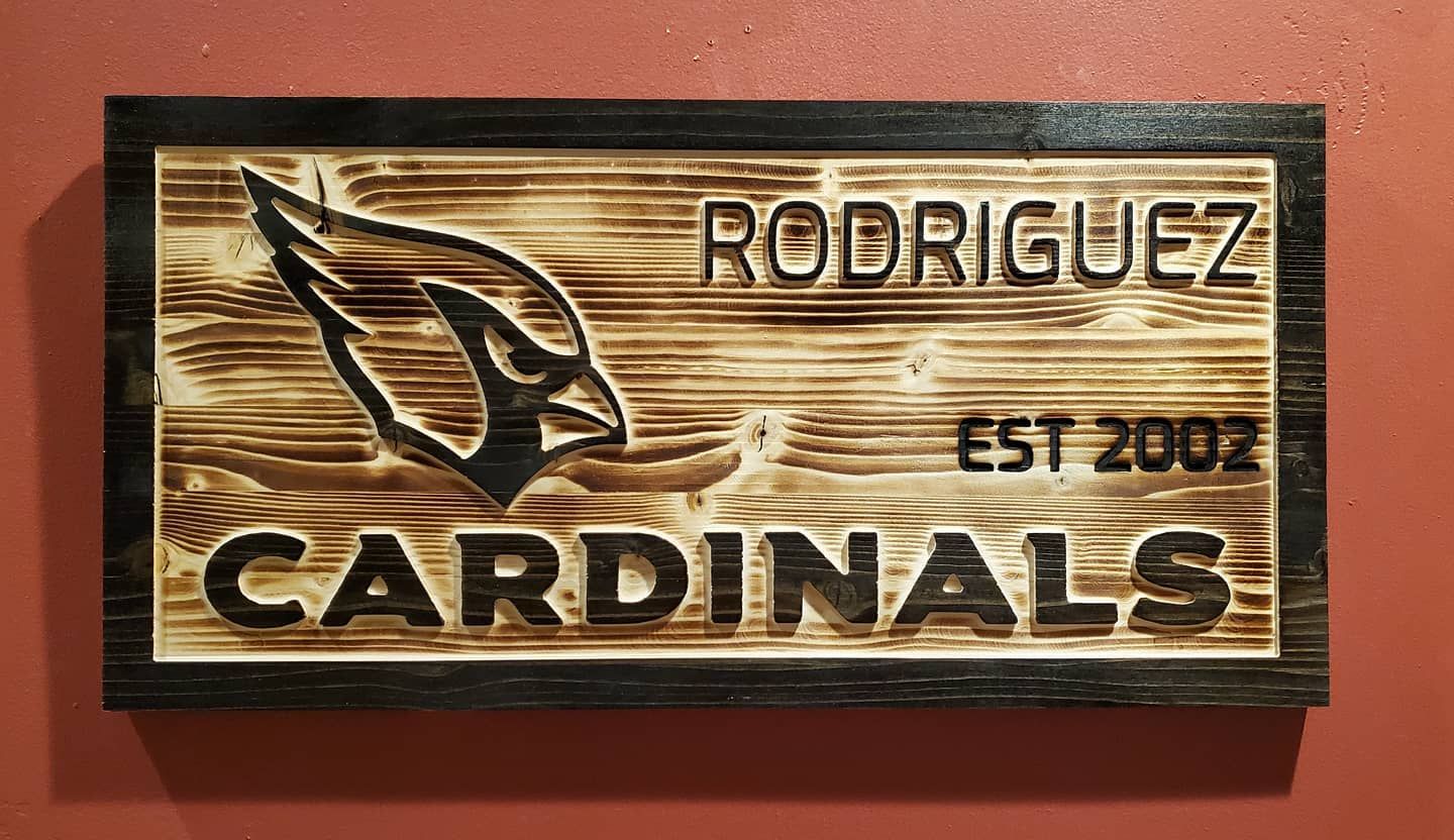 Wooden sign with Arizona Cardinals logo,