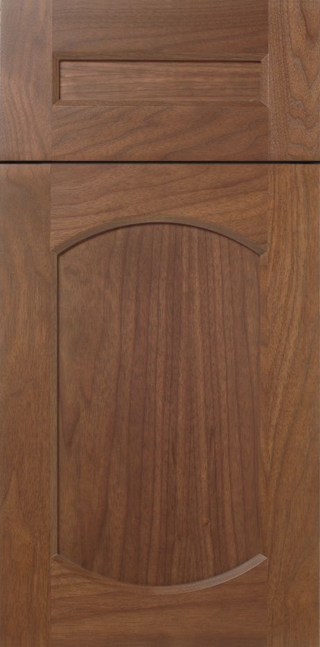 Wooden kitchen cabinet door with raised panel and arched details.
