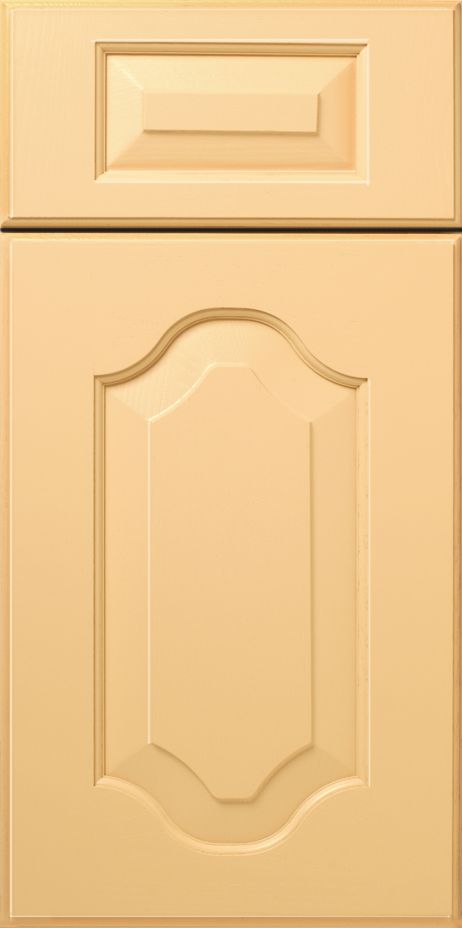 Beige kitchen cabinet door with detailed paneling and recessed top.