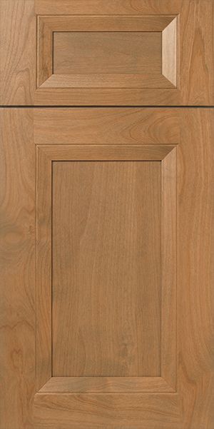 Wooden cabinet door with a raised panel and a warm brown stain.