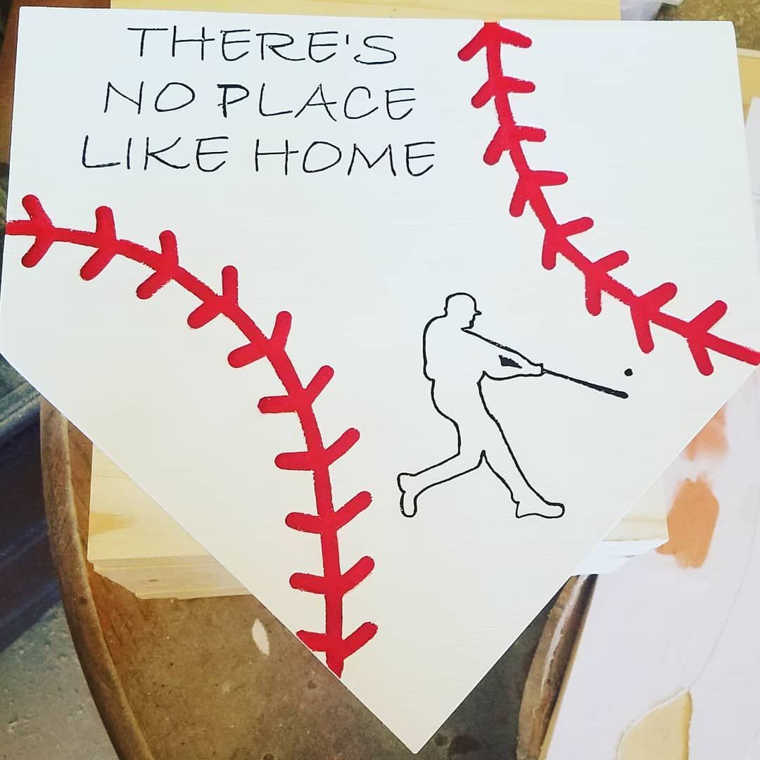 Baseball-themed sign with a batter silhouette, stitched seams, and text