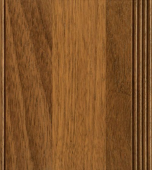 Wooden cabinet door with vertical grain, in shades of brown and a grooved edge.