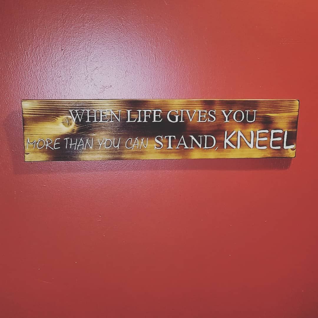 Wooden sign with quote