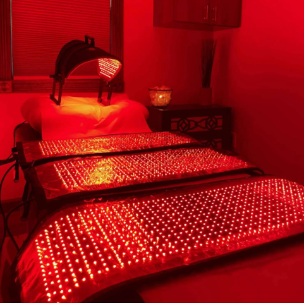 A bed with red lights on it in a room