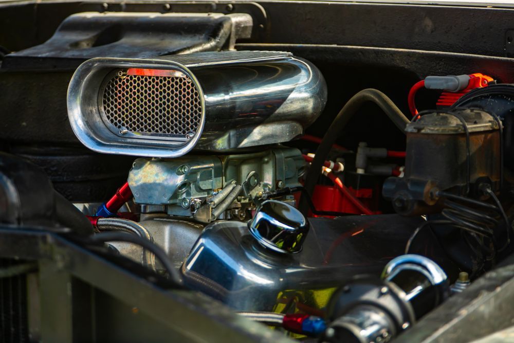 A Close Up Of A Car Engine With A Carburetor — Hastings Diesel Service In Port Macquarie, NSW