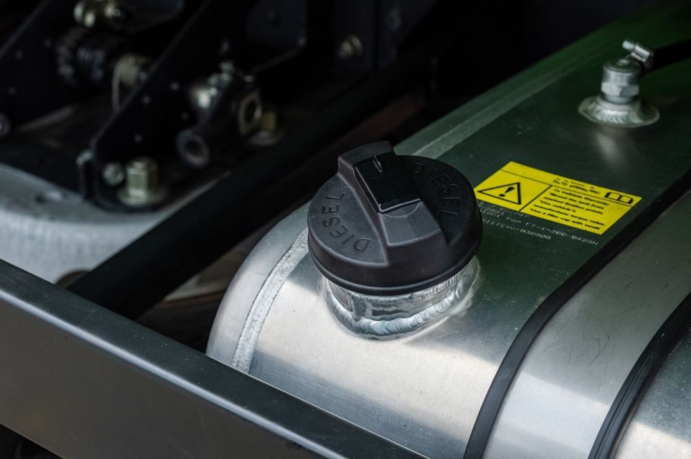 A Close Up Of A Stainless Steel Tank With A Black Cap On It — Hastings Diesel Service In Laurieton, NSW