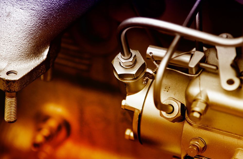 A Close Up Of A Metal Object With A Hose Attached To It — Hastings Diesel Service In Wauchope, NSW