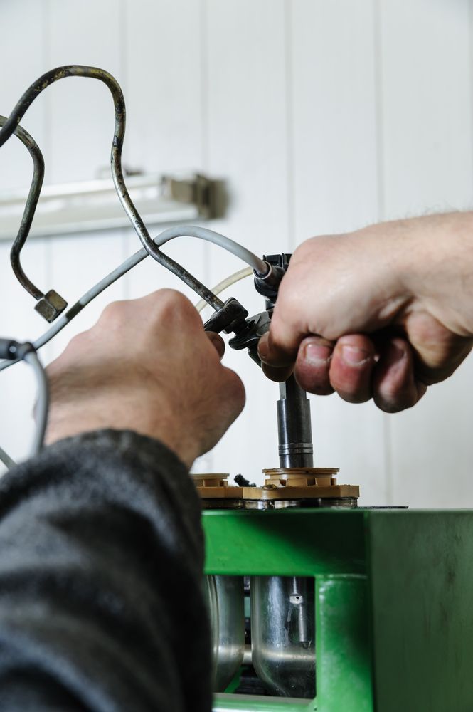 A Close Up Of A Person Working On A Machine — Hastings Diesel Service In Port Macquarie, NSW