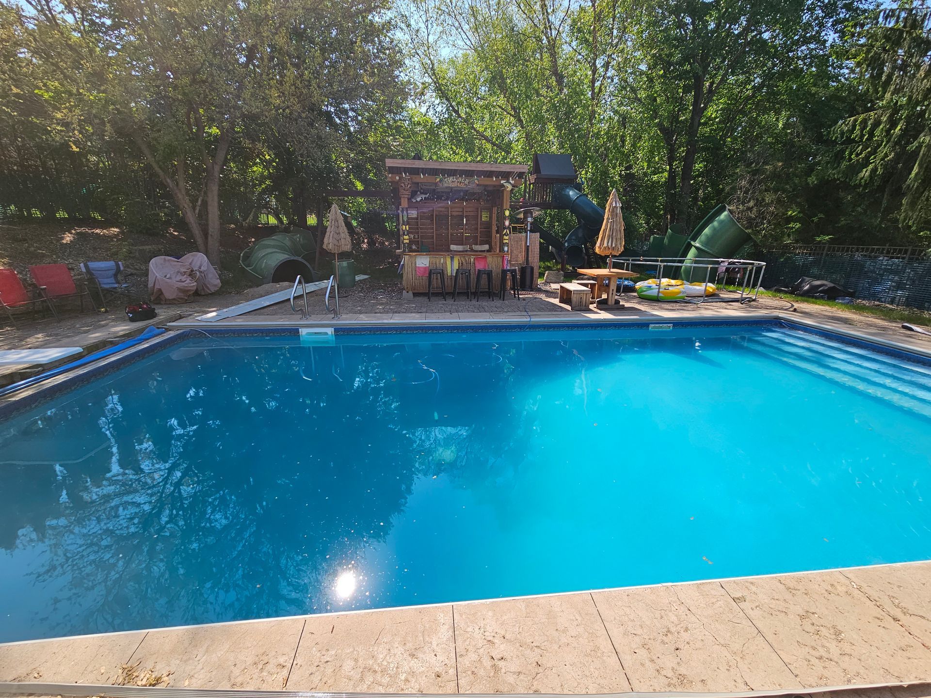 Furniture setup and installation by pool.