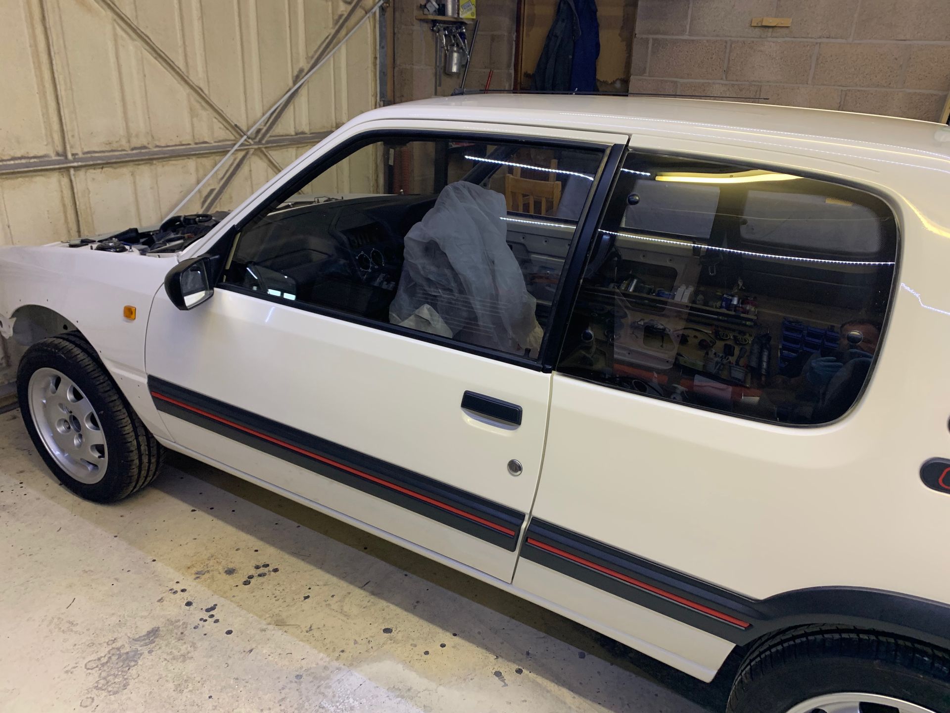 Eziglass - Vehicle Glazing Services gallery image. Peugeot 205 windscreen and heated rear window installation.