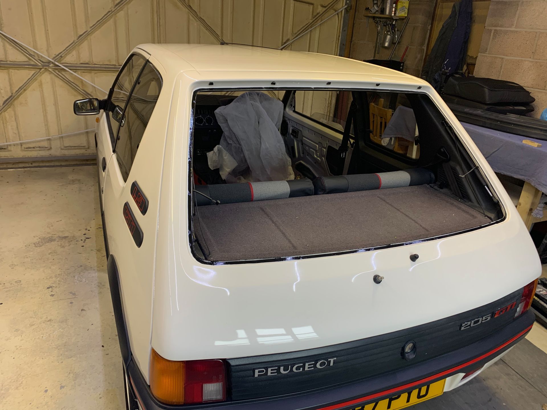 Eziglass - Vehicle Glazing Services gallery image. Peugeot 205 windscreen and heated rear window installation.