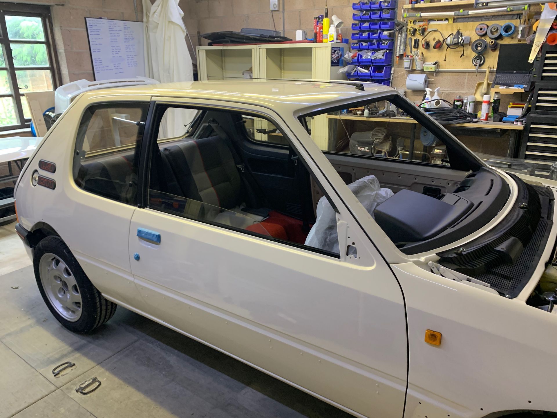 Eziglass - Vehicle Glazing Services gallery image. Peugeot 205 windscreen and heated rear window installation.