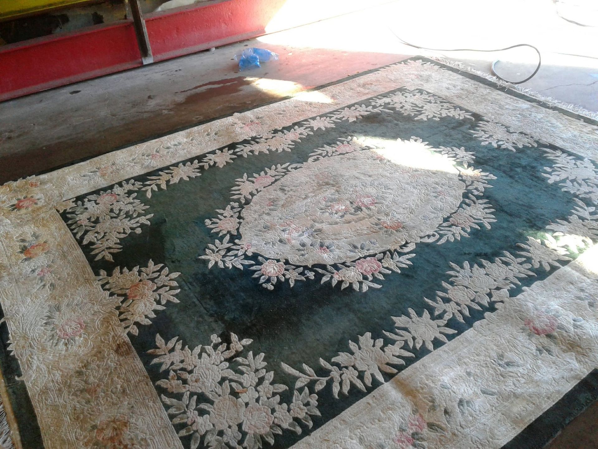 A rug that has a floral pattern on it
