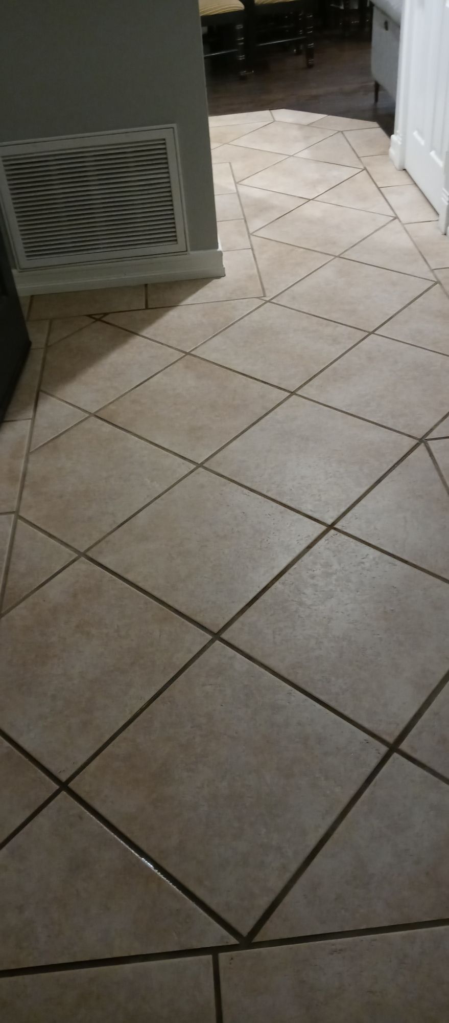 A close up of a tiled floor in a room.
