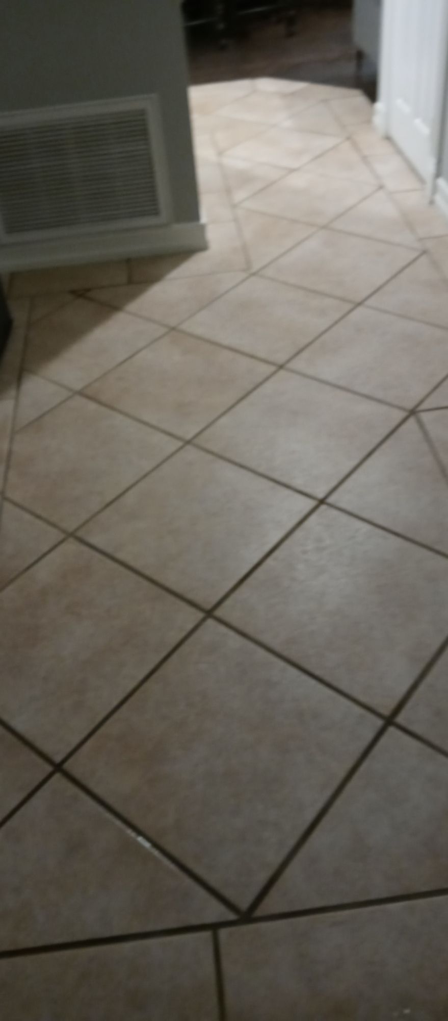 A close up of a tiled floor in a room.