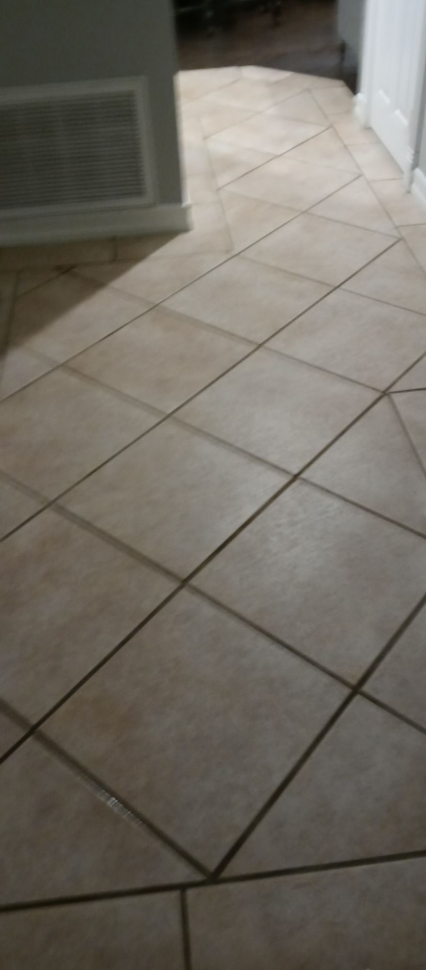 A close up of a tiled floor in a room.