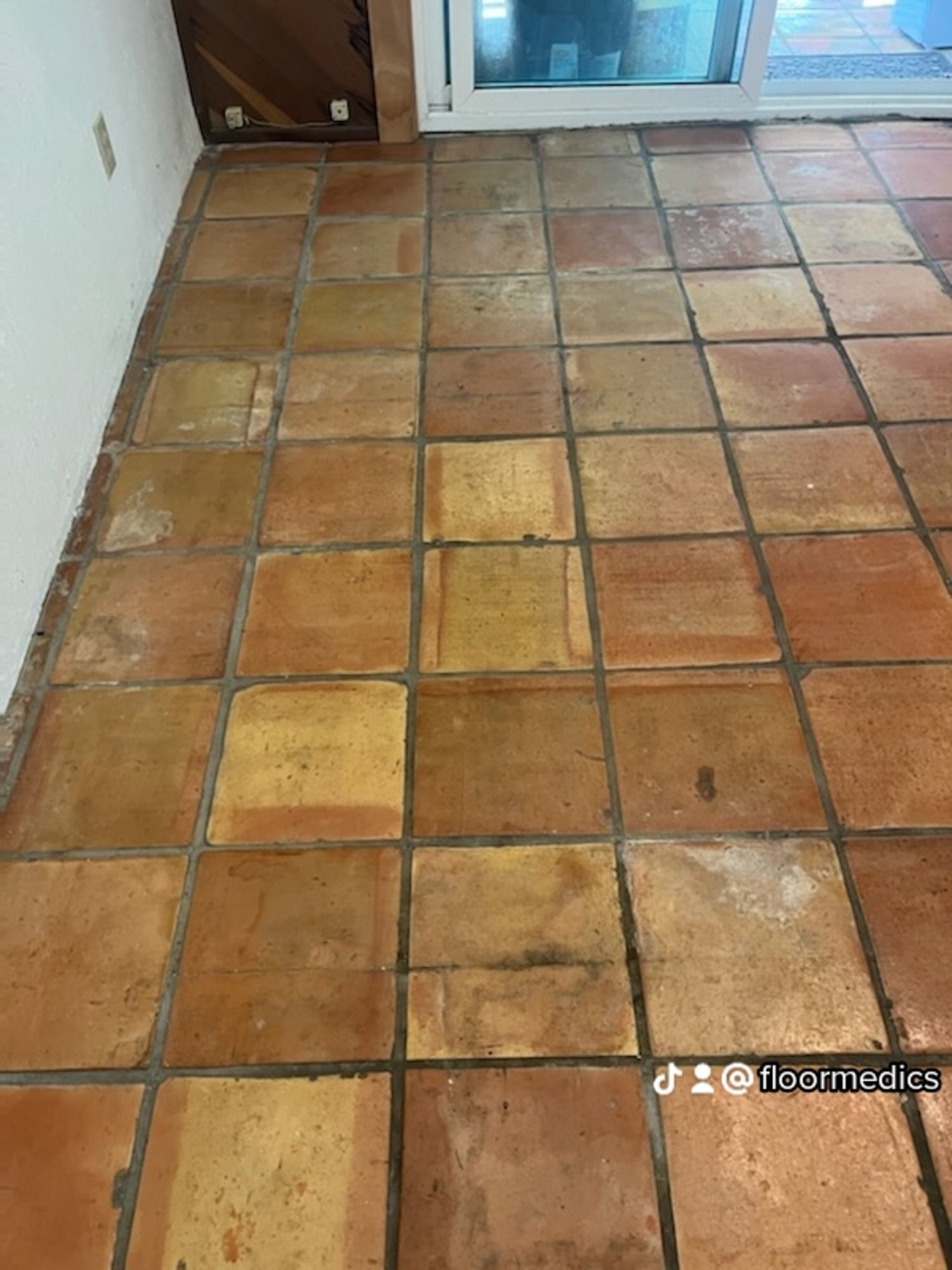 A close up of a tiled floor in a room.