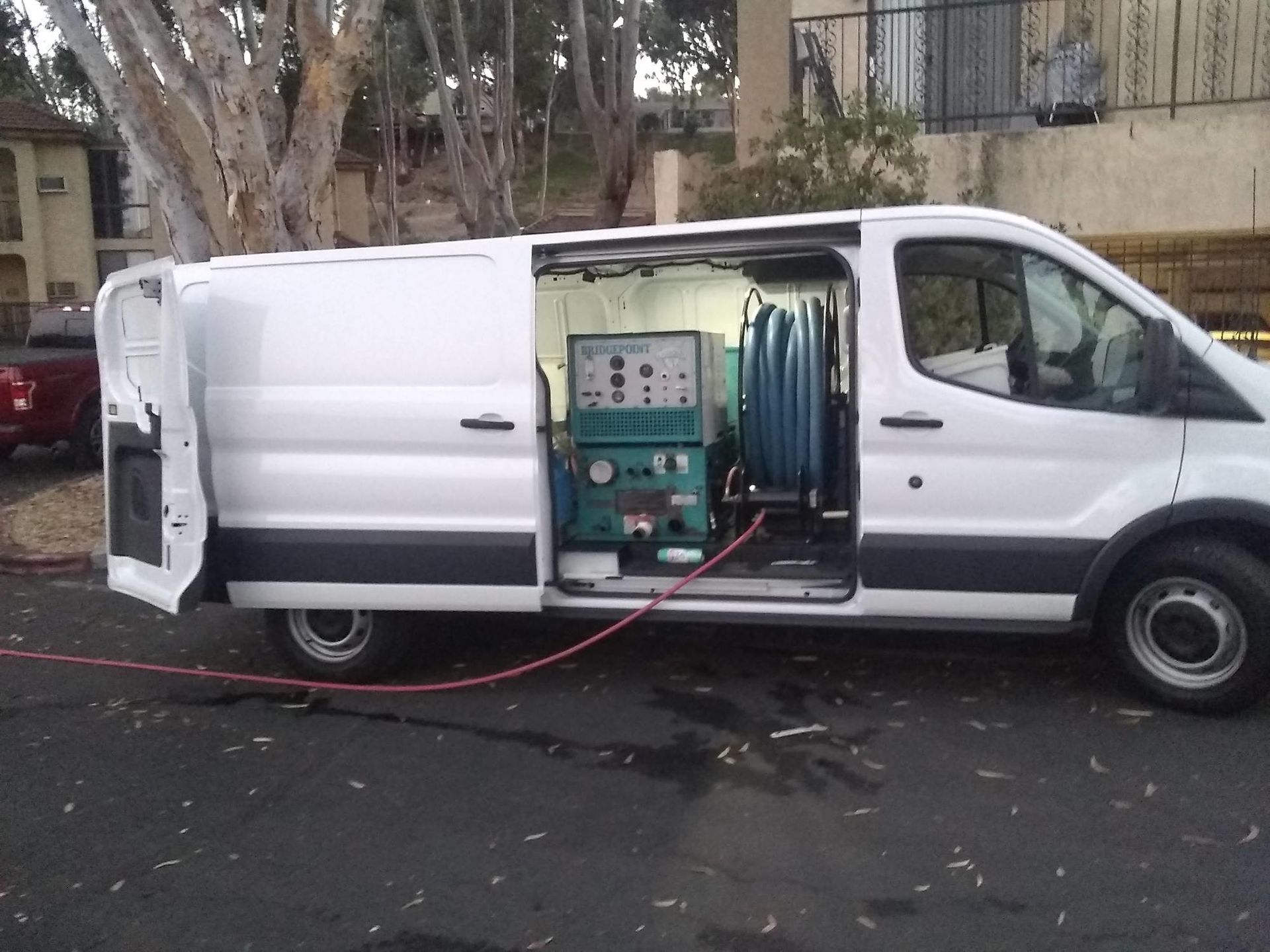 A white van with a machine inside of it