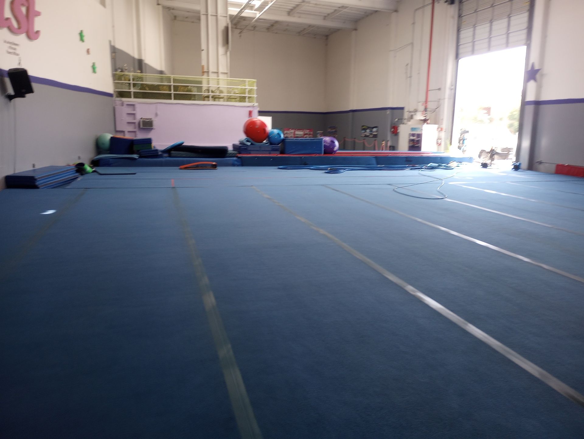 An empty gym with a sign that says ' a ' on it