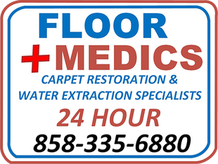 A sign for floor medics carpet restoration and water extraction specialists